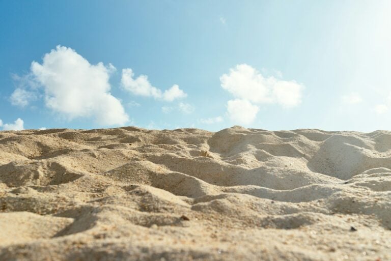 brown sand under blue sky during daytime