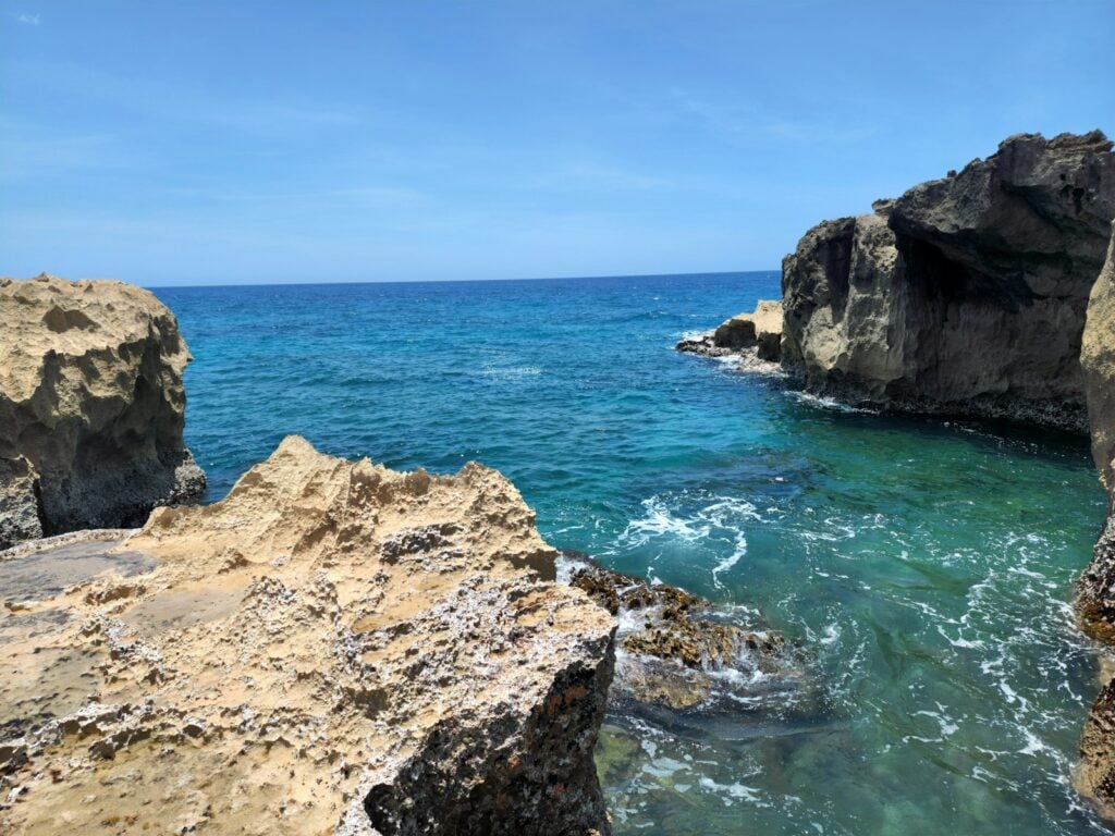 a body of water near a rocky shore
