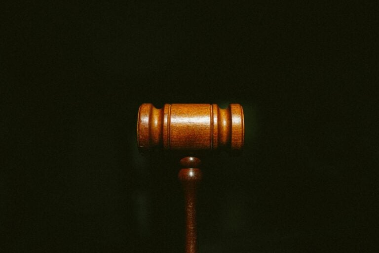 brown wooden stand with black background