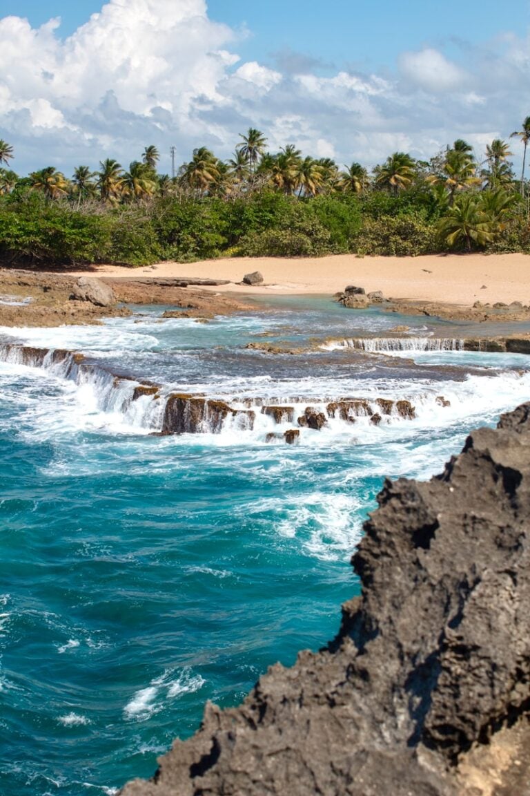 a view of the ocean from a rocky shore