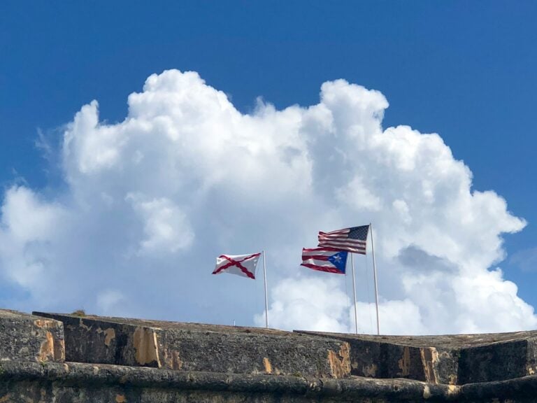 three assorted-color nation flags